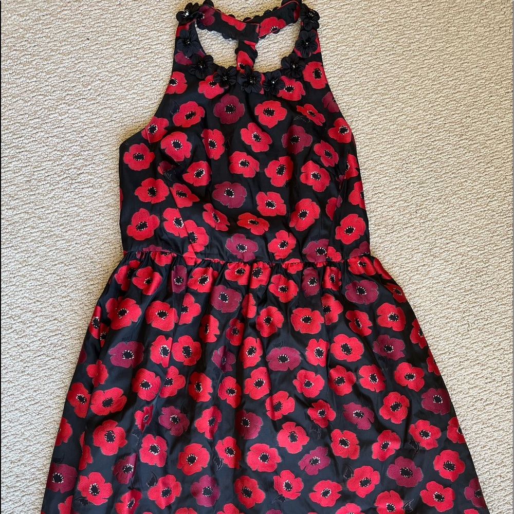 A black and red floral Kate Spade cocktail length dress.